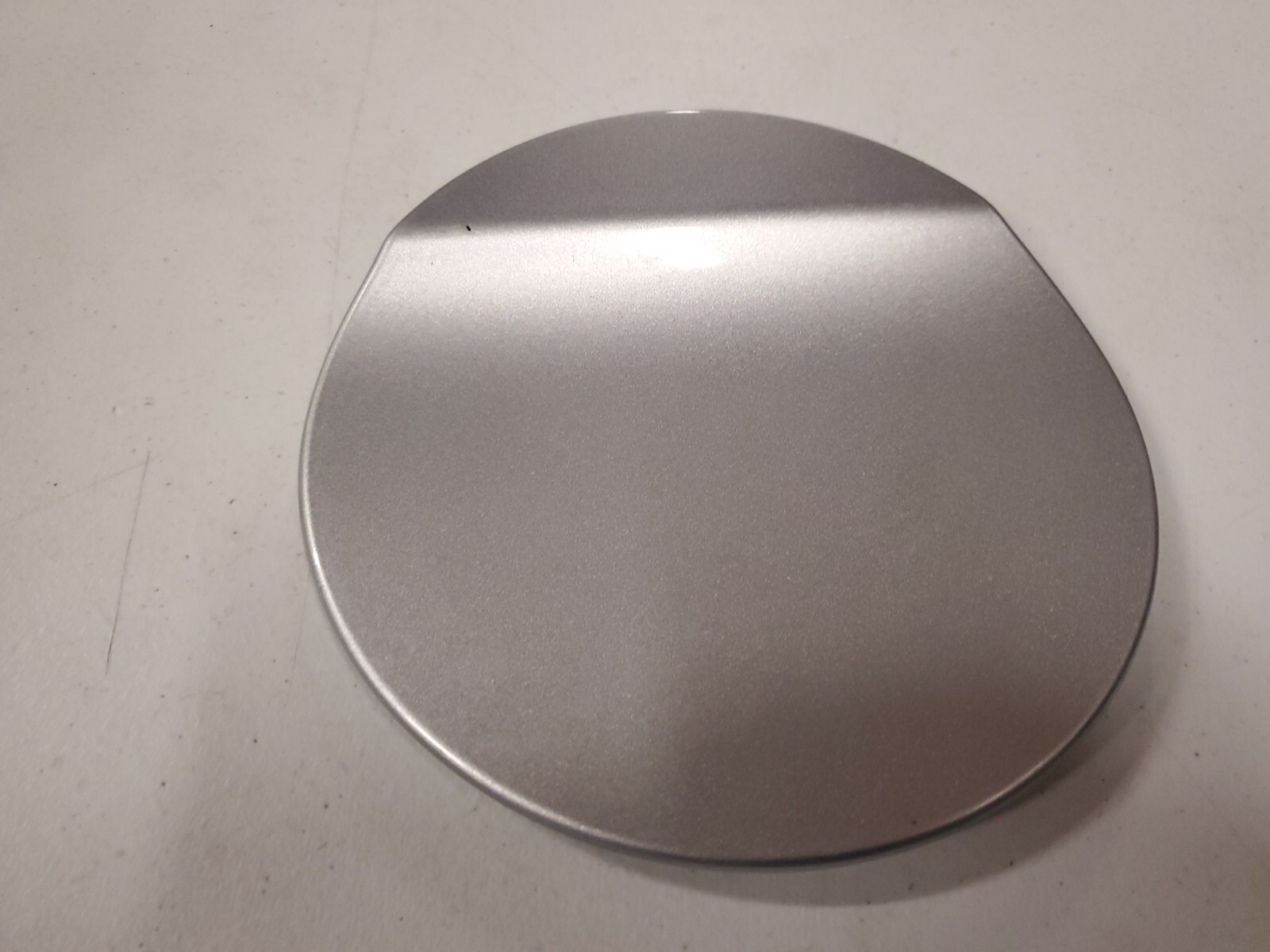 2010, 2011, 2012, 2013, 2014, 2015, 2016, 2017, 2018, 2019 Ford Taurus Silver Fuel Filler Door (OEM)
