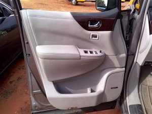 2011-2017 Nissan Quest Beige Door Interior Trim Panel - Front (Used OEM)
