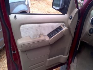 2006-2010 Ford Explorer Tan Door Interior Trim Panel with Power Windows and Locks - Front, Left (Driver) (Used OEM)