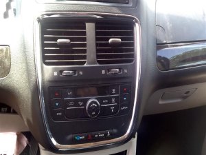 2011-2016 Chrysler Town &amp; Country Black Radio and Air Vent Instrument Panel Bezel (Used OEM)