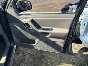 1999-2004 Jeep Grand Cherokee Tan Leather Door Interior Trim Panel - Front, Right (Passenger) (Used OEM)