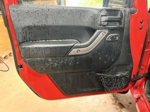 2011-2018 Jeep Wrangler Black Door Interior Trim Panel - Front, Left (Driver) (Used OEM)