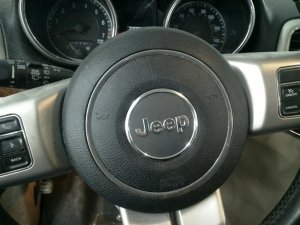 2011-2013 Jeep Grand Cherokee Black Steering Wheel Air Bag - Left (Driver) (Used OEM)