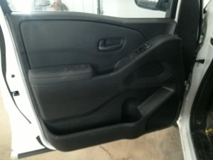 2022-2025 Nissan Frontier Black Door Interior Trim Panel with Power Windows and Locks - Front, Left (Driver) (Used OEM)