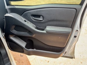 2022-2025 Nissan Frontier Black Door Interior Trim Panel - Front, Right (Passenger) (Used OEM)