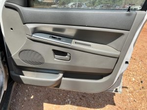 2005-2007 Jeep Grand Cherokee Tan Door Interior Trim Panel - Front, Right (Passenger) (Used OEM)