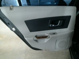 2003-2007 Cadillac CTS Tan Door Interior Trim Panel with Power Windows and Locks - Rear, Left (Driver) (Used OEM)