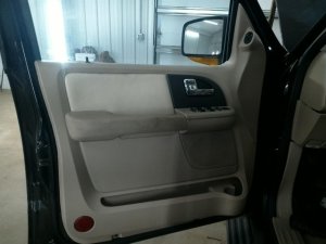 2003-2006 Lincoln Navigator Tan Door Interior Trim Panel with Power Windows and Locks - Front, Left (Driver) (Used OEM)