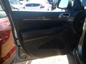 2011-2013 Jeep Grand Cherokee Black Door Interior Trim Panel with Power Windows and Locks - Front, Left (Driver) (Used OEM)