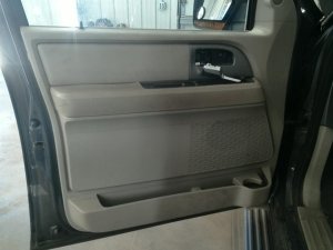 2007-2014 Lincoln Navigator Tan Door Interior Trim Panel with Power Windows and Locks - Front, Left (Driver) (Used OEM)