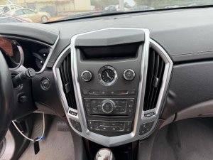 2011-2012 Cadillac SRX Radio and Temperature Control Panel with Navigation (Used OEM)
