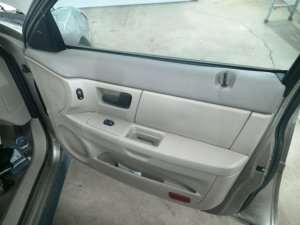 2000-2007 Ford Taurus Tan Door Interior Trim Panel with Power Windows and Locks - Front, Right (Passenger) (Used OEM)