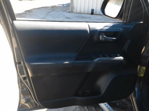 2016-2018 Toyota Tacoma Black Door Interior Trim Panel with Power Windows and Locks - Front, Left (Driver) (Used OEM)