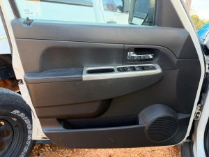 2007-2011 Dodge Nitro Black Door Interior Trim Panel with Power Windows and Locks - Front, Left (Driver) (Used OEM)
