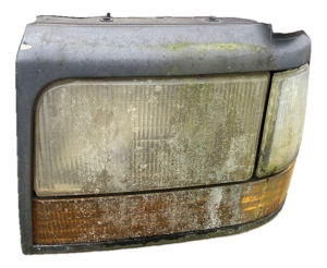 1992-1996 Ford Bronco Maroon Headlight Assembly - Left (Driver) (Used OEM)