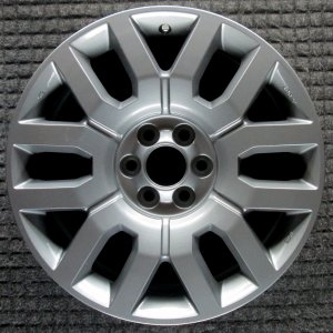 2009-2014 Nissan Frontier Black 18x7.5 6 U-Spoke Machined Charcoal Alloy Wheel (Remanufactured OEM)