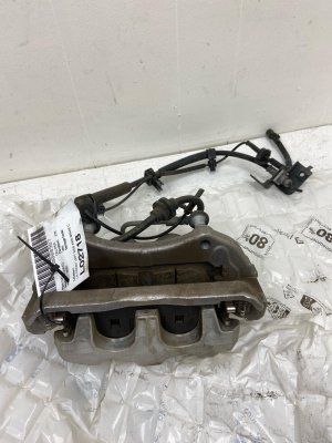 2020-2024 Lincoln Aviator Disc Brake Caliper with Wheel Speed Sensor - Front, Left (Driver) (Used OEM)