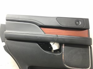 2018-2024 Lincoln Navigator Ebony (Black) Door Interior Trim Panel with Wood Trim - Rear, Left (Driver) (Used OEM)