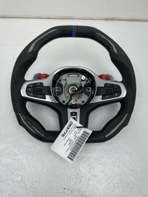  BMW X5 m Heated Carbon Fiber Steering Wheel with Shifter Paddles and Control Switches - Front (Used OEM)