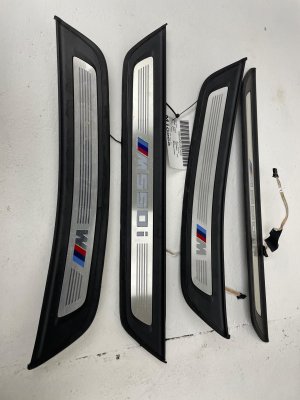 2018-2023 BMW M5 Illuminated Door Sill Trim Plate Set - Front (Used OEM)