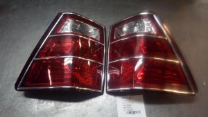 2007-2010 Jeep Grand Cherokee Chrome Tail Light Assembly - Left (Driver) (Used OEM)