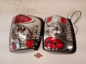 1999-2002 Jeep Grand Cherokee Aftermarket Tail Light Assembly - Left (Driver) (Used OEM)