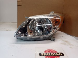 2005-2008 Pontiac Vibe Chrome Bezel Headlight Assembly - Left (Driver) (Used OEM)