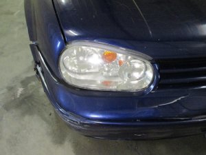 2002-2005 Volkswagen GTI Halogen Headlight Assembly with Chrome Inner Bezel - Right (Passenger) (Used OEM)